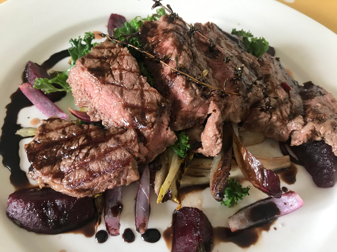 Sirloin Steak with a medley of chicory, kale & beetroot served with a balsamic and thyme glaze